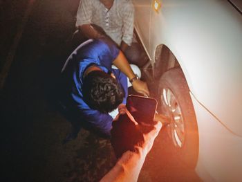 High angle view of people on car
