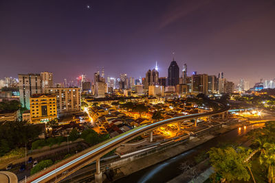 High angle view of illuminated buildings in city at night