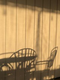 Close-up of fence against sky during sunset