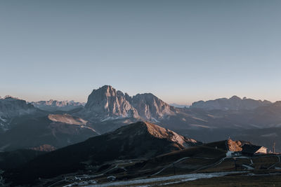 Scenic view of snowcapped mountains against clear sky