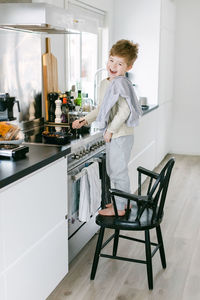 Boy preparing food in kitchen