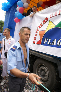 Two men standing on balloons