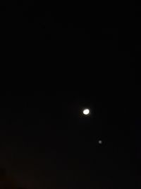 Low angle view of moon against sky at night