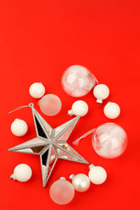 High angle view of candies against red background