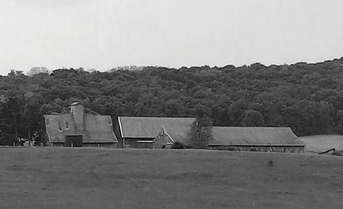 Built structure on landscape against clear sky