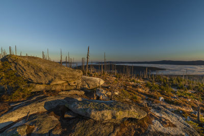 Scenic view of land against clear blue sky