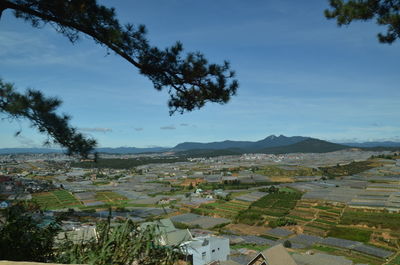 Aerial view of townscape against sky