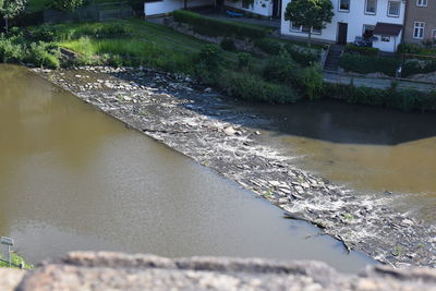 High angle view of river by buildings in city