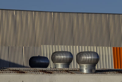 Ventilation heater on roof in brazilia factory. rotary chimney aspirator on the industrial roof