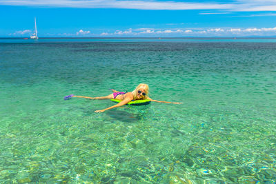 Woman in bikini in sea