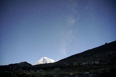 Low angle view of mountain against clear sky at night
