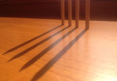 High angle view of shadow on hardwood floor