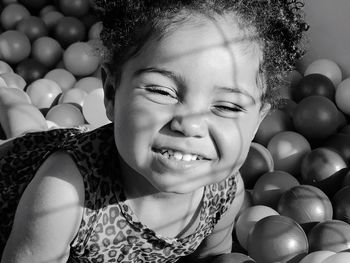 Portrait of cute girl playing with balls