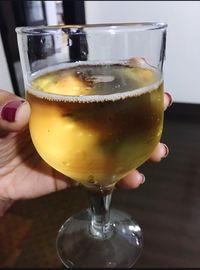 Close-up of woman holding wineglass