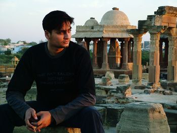 Young man visiting old ruins