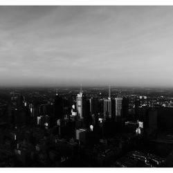 High angle view of buildings in city against sky