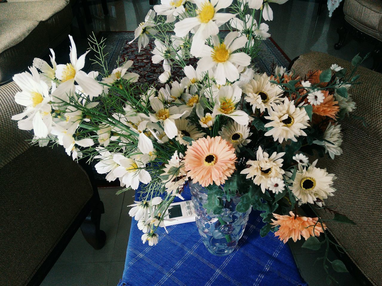 HIGH ANGLE VIEW OF FLOWERS ON VASE