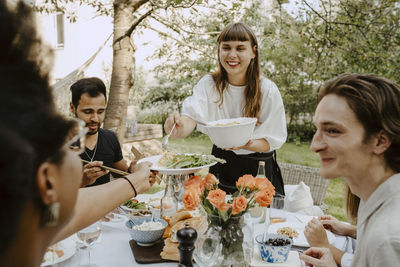 Young couple sitting on table