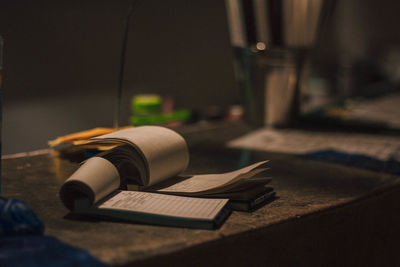 Close-up of open book on table at home