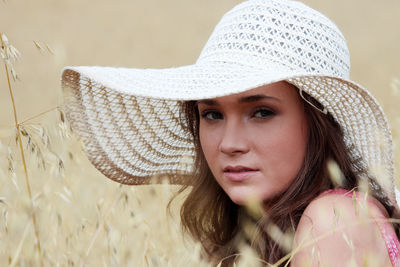 Portrait of young woman in hat