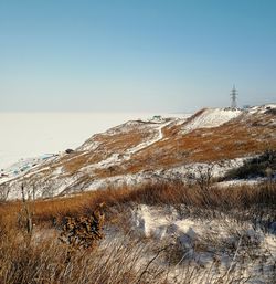 Scenic view of sea against clear sky during winter