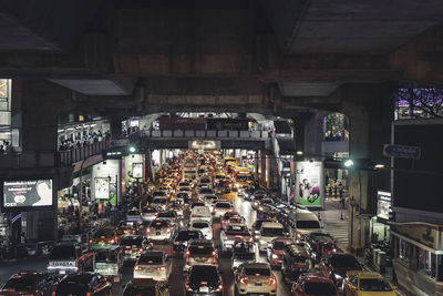 Illuminated traffic on city street at night
