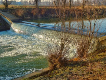 View of dam on riverbank