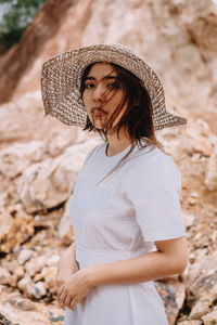 Midsection of woman wearing hat