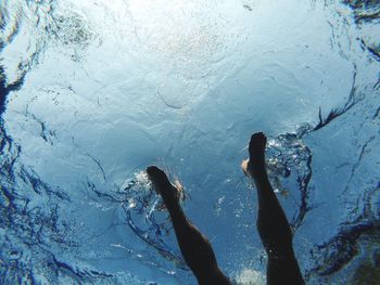 Low section of person on frozen water