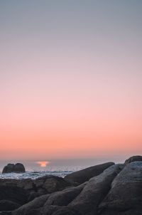 Scenic view of sea against clear sky during sunset