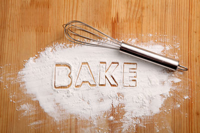 Directly above shot of text on wooden table