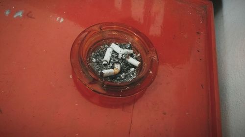 High angle view of cigarette on mirror