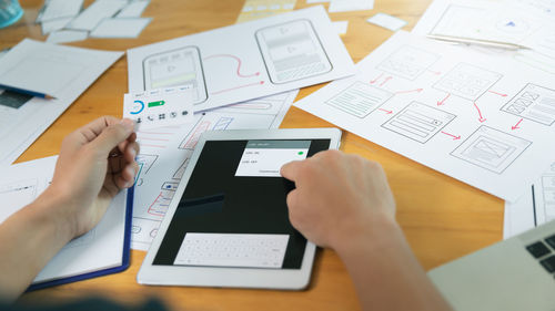 Low angle view of man using laptop on table