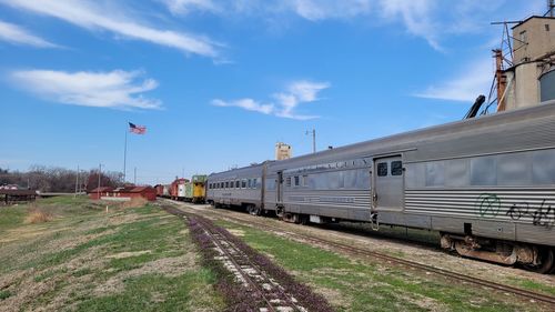 Train on railroad tracks against sky