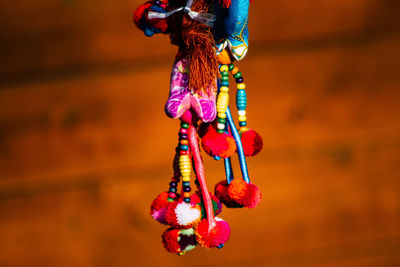 Close-up of multi colored decoration hanging against blurred background