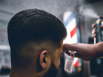 Close-up of man in barber shop