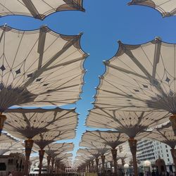 Low angle view of amusement park against clear sky