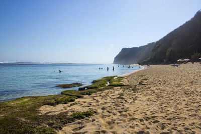 Scenic view of beach against clear sky