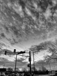 Low angle view of silhouette bridge against sky