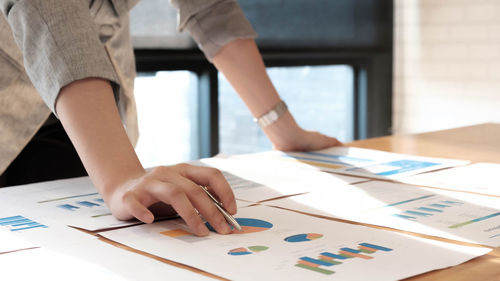 Low section of man and woman on table