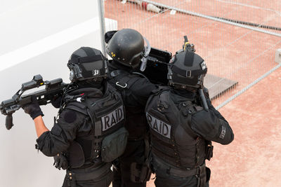 Police force standing with guns