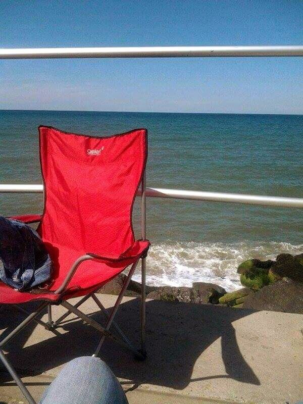 CHAIR ON SANDY BEACH