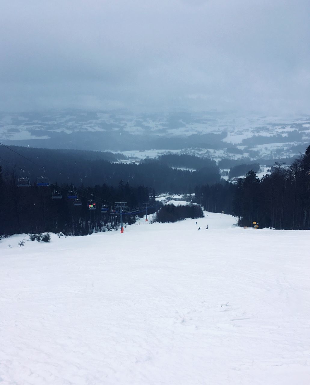 snow, winter, cold temperature, sky, architecture, building exterior, beauty in nature, nature, built structure, scenics - nature, environment, cloud - sky, covering, tranquil scene, white color, tranquility, landscape, no people, tree, outdoors, snowcapped mountain, ski resort