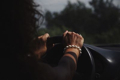 Close-up of hand holding the road