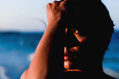 Close-up of woman against sky