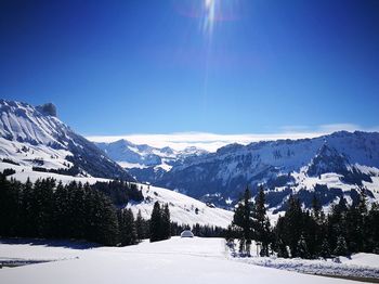 Scenic view of snowcapped mountains against sky