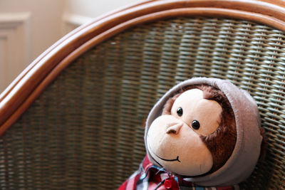 Close-up of stuffed toy monkey on chair