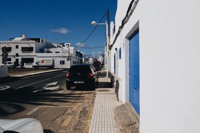 Cars on city against clear sky