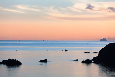 Scenic view of sea at sunset