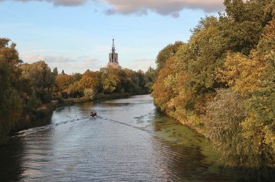 River amidst trees against sky